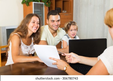 Parents With Daughter Glad Hearing Words Of Social Worker In   Room