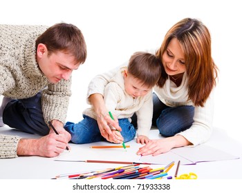 Parents drawing together with  their toddler son