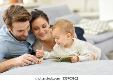 Parents Enjoying Playing With Baby Girl