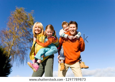 Similar – Image, Stock Photo Sisters enjoying piggyback ride