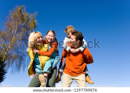 Similar – Image, Stock Photo Sisters enjoying piggyback ride