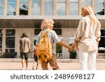 Parents going back to school with their children after summer holidays lockdown. The start of new academic semester year. Preparation for lessons classes