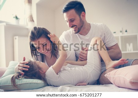 Similar – Image, Stock Photo Man and pregnant woman looking baby clothes