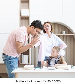 Parents Helping Her Daughter With Lessons And Homework. Mother Protecting Her Child From Angry Father Who Is Going To Hit Her. Punishment And Education Concept 