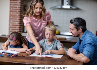 Parents Helping The Kids With Their Homework, Social Distancing And Self Isolation In Quarantine Lockdown