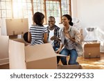 Parents, kids and laughing with boxes for moving in in new house with fun, playing and silly. People, home and happy or smile as interracial family with furniture for apartment with support or love