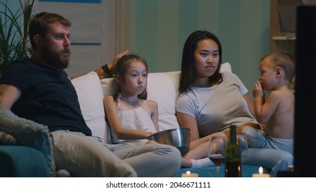 Parents With Kids Watching TV