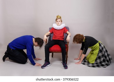 Parents kneel down before their son. Parenting style concept