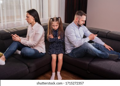 parents look at the phone and ignore their baby