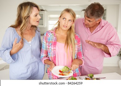 Parents Making Teenage Daughter Do Chores At Home