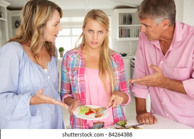 Parents Making Teenage Daughter Do Chores At Home