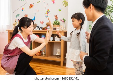 Parents picking up their nursery school - Shutterstock ID 1680151441