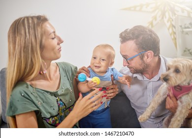 Parents playing with a baby at home. - Shutterstock ID 1467210470