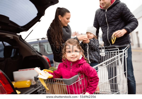 Parents Pushing Shopping Cart Groceries Their Stock Photo 516962356 ...