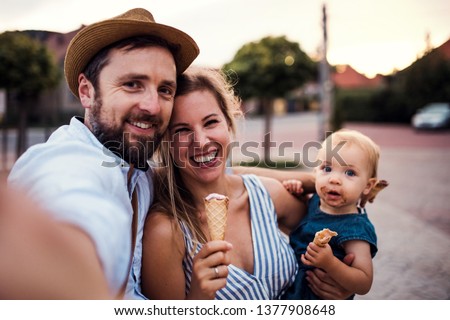 Similar – Mother with eating toddler.