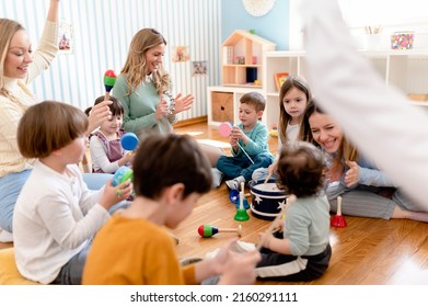 Parents taking part in the activities for preschool children. Healthy learning environment. Teacher and parents working together. - Shutterstock ID 2160291111