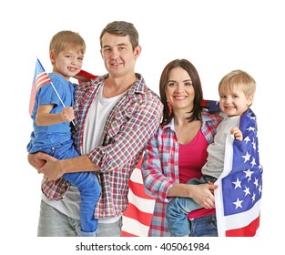 Parents and their sons with  American flag isolated on white