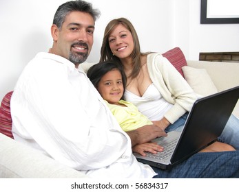 Parents whit son look in notebook on white background - Shutterstock ID 56834317