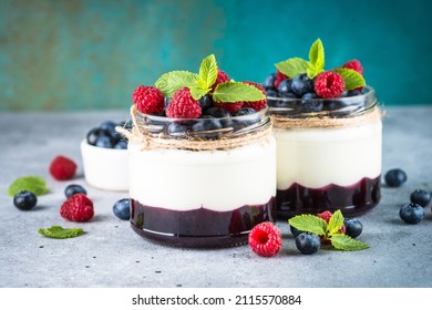 Parfait With Cream And Fresh Berries In The Glass Jar.