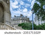 Paris, buildings in the Marais, in the center, in a typical street, with the Saint-Jacques tower