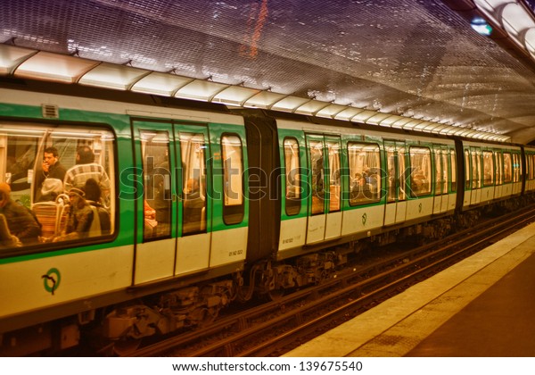 PARIS, DEC 4:\
Underground train inside a metro station, December 4, 2012 in\
Paris. Paris Metro is the 2nd largest underground system worldwide\
by number of stations\
(300)
