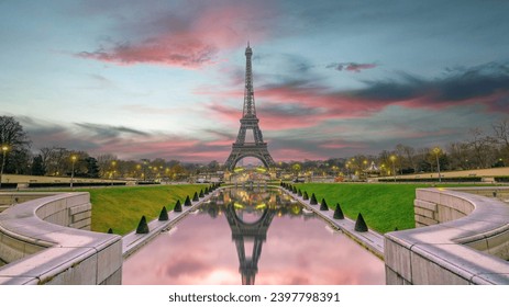 Paris Eiffel Tower and Champ de Mars in Paris, France. Eiffel Tower is one of the most iconic landmarks in Paris. The Champ de Mars is a large public park in Paris
