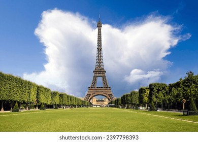 Paris Eiffel Tower and Champ de Mars in Paris, France. Eiffel Tower is one of the most iconic landmarks in Paris. The Champ de Mars is a large public park in Paris
