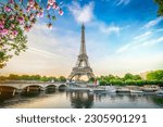 Paris Eiffel Tower and river Seine with sunrise in Paris, France. Eiffel Tower is one of the most iconic landmarks of Paris, web banner format