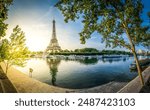 Paris Eiffel Tower and river Seine with sunrise sun in Paris, France. Eiffel Tower is one of the most iconic landmarks of Paris, panorama with sunshine