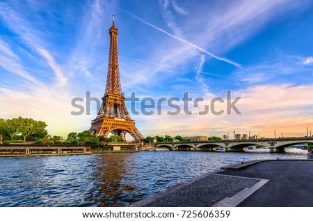 Paris Eiffel Tower and river Seine at sunset in Paris, France. Eiffel Tower is one of the most iconic landmarks of Paris. Postcard of Paris