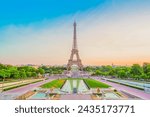 Paris Eiffel Tower and Trocadero garden at sunset in Paris, France. Eiffel Tower is one of the most famous landmarks of Paris., toned