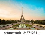 Paris Eiffel Tower and Trocadero garden at sunset in Paris, France. Eiffel Tower is one of the most famous landmarks of Paris.