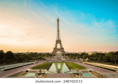 Paris Eiffel Tower and Trocadero garden at sunset in Paris, France. Eiffel Tower is one of the most famous landmarks of Paris.