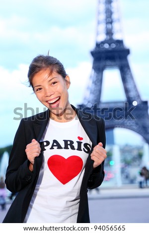Paris Eiffel tower woman happy and excited in front of the Eiffeltower, Paris, France.