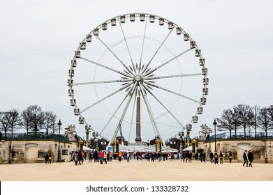 PARIS - FEBRUARY 3: A ferris wheel (Roue de Paris) on the Place de la Concorde from the Tuileries Garden on February 3, 2013 in Paris. It was first installed for the 2000 millennium celebrations.