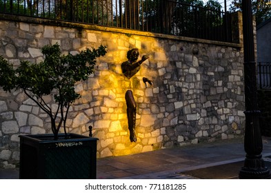 Paris, France - 06052016 : The Man Who Walks Through Walls Illuminated By Sunset Light In Marcel Aymé Square, Montmartre