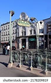 Paris, France - 08.07.2022: The Famous Paris Metro Sign Designed By Hector Guimard