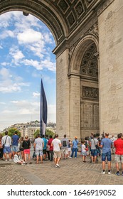Paris, France, 08.24.2017. Raising The French National Flag On The Arc De Triomphe In Paris, In Memory Of The Tragedy Of St. Bartholomew's Night