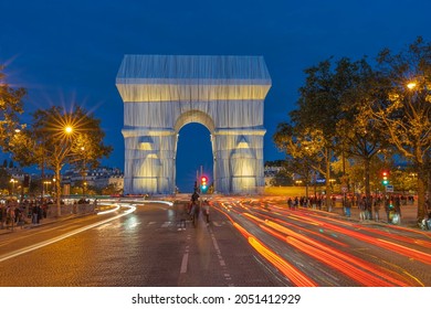 Paris, France - 09 30 2021: Place Charles de Gaulle. L'Arc de Triomphe, Wrapped by night