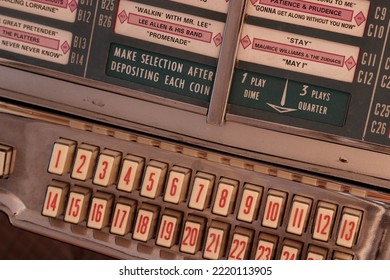 Paris, France - 10 30 2022 : Close Up On The Track List Of A Wurlitzer 1100 Jukebox. A Vintage Jukebox With Legendary Rock Songs From The 50s. The Buttons Used For Operating The Jukebox Are Visible.