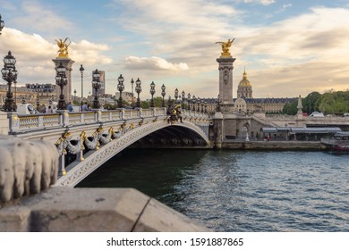  Paris / France / 10.07.2019. View on Pont Alexandre III bridge in Paris in sunset.