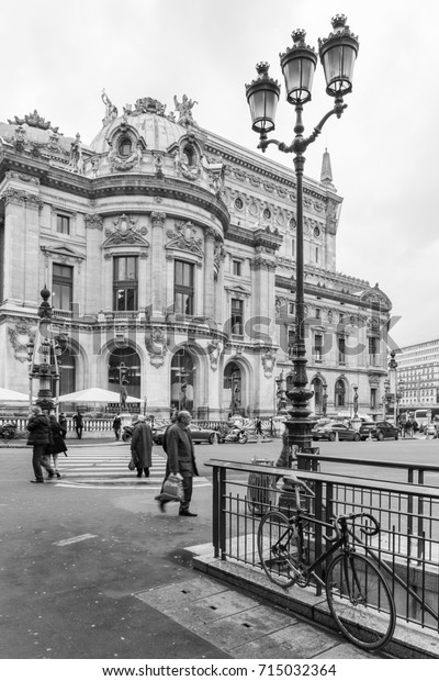 PARIS, FRANCE – 12/10/2014: Touristic view at the\
city: Paris near the downtown, street, buildings, cars and walking\
people