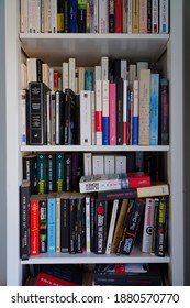 PARIS, FRANCE -15 DEC 2020- View Of A Bookshelf Filled With Miscellaneous Used Vintage Paperback Books In French.