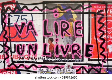 PARIS, FRANCE -16 JUNE 2015- Va Lire Un Livre Graffiti Street Art In The French Capital. Paris Has Become One Of The European Centers For Street Art.