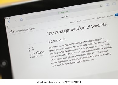 PARIS, FRANCE - 17 OCTOBER 2014: Photo of Apple iPad tablet with apple.com webpage of the new iMac 5k showing its Wi-Fi speed. Apple unveiled the new iMac with 5K Retina display on 16 October