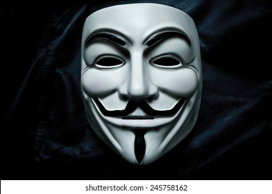 Paris - France - 18 January 2015 - Vendetta mask on black bacground . This mask is a well-known symbol for the online hacktivist group Anonymous 