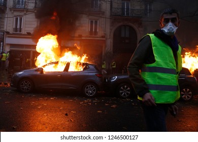 Paris, France.  1st December 2018. 
. Demonstrators Light A Car  On Fire During A Protest Of The Yellow Jackets. 