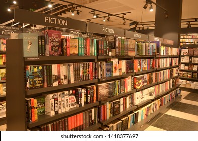 Paris, France, 2020. Books On Display On Shelves In A Bookstore In The Fiction Section In A Shopping Mall.