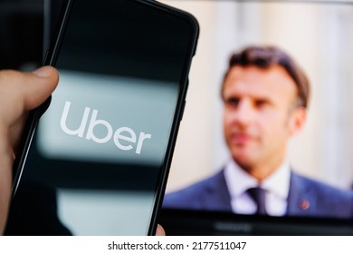 Paris, France - 2022 July 10: Uber App On Mobile Screen And Emmanuel Macron In Background. Uber Leak Scandal