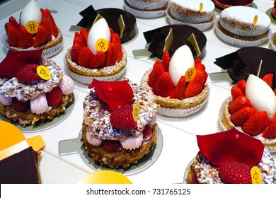 PARIS, FRANCE -25 MAR 2017- Display Of Colorful Gourmet French Pastries At Fashionable Pierre Herme Pastry Shop In Paris.